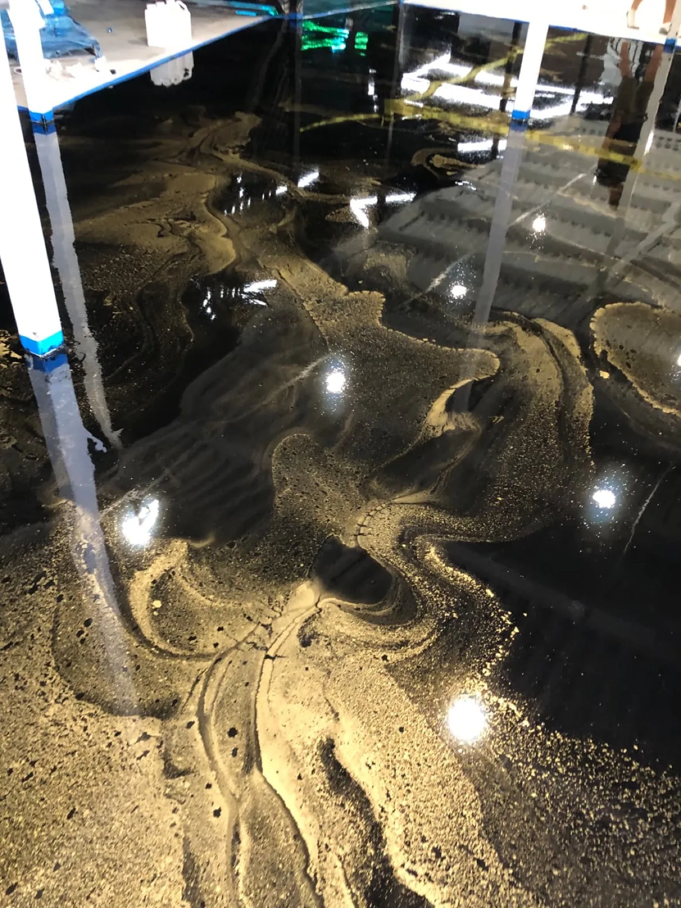 Black and gold metallic epoxy floor with a mirror gloss finish in Goldsboro, North Carolina